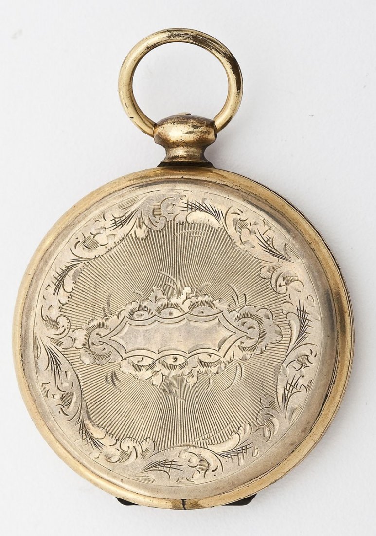 Antique Engraved Locket: DESCRIPTION: Antique round locket with engraved decoration housing a fabric swatch and photo. 1-1/2" diameter.