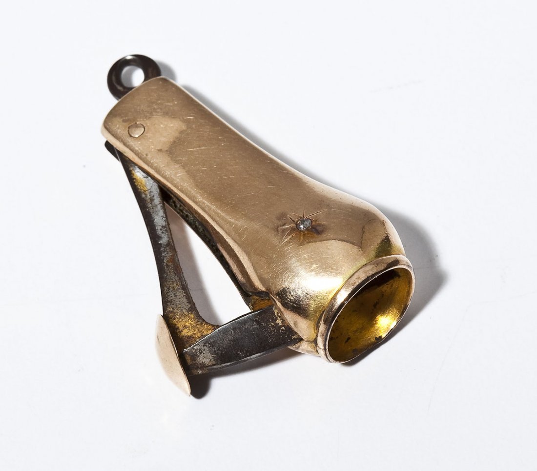 Gold Cigar Cutter Fob: DESCRIPTION: Tested gold cigar cutter fob with small rough diamond crystal. 2" long.