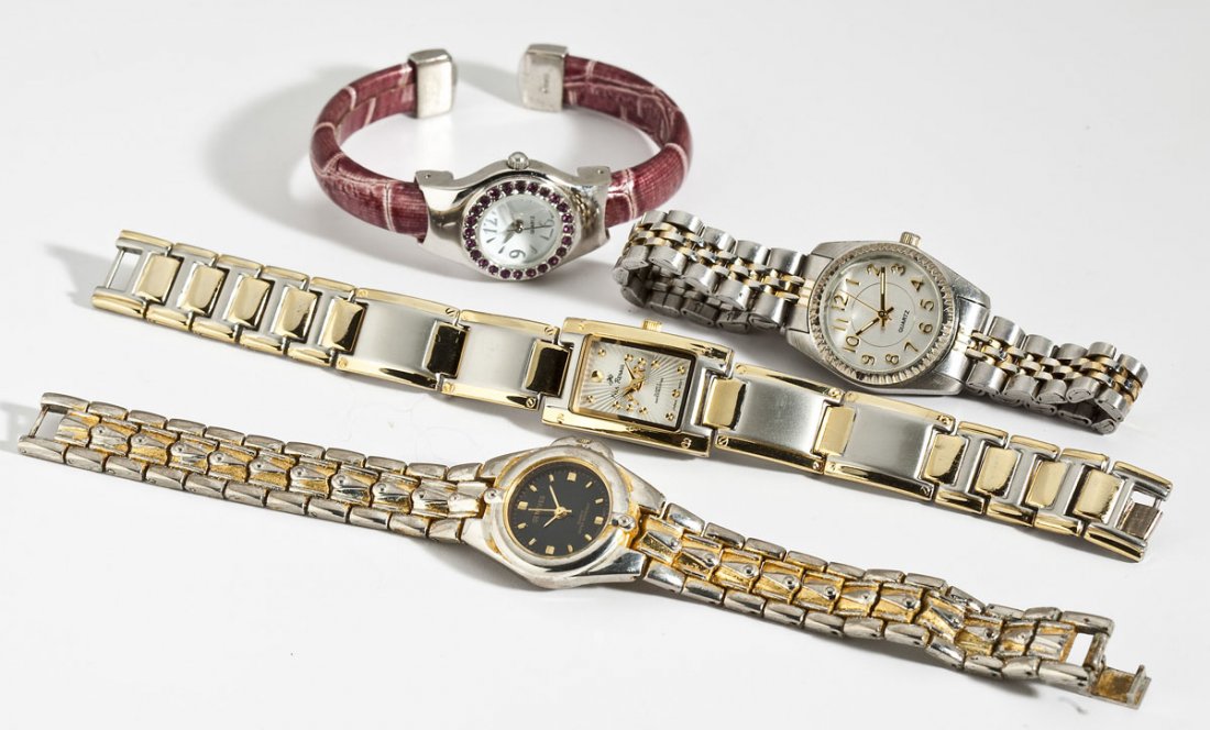 4 Lady's Fashion Wristwatches incl Geneves: DESCRIPTION: Four lady's wristwatches. Includes: 1) Pink hinged cuff with deep pink crystals. 2) Two-tone rectangular. 3) Two-tone wih round dial. 4) Two-tone Geneves with round black dial.