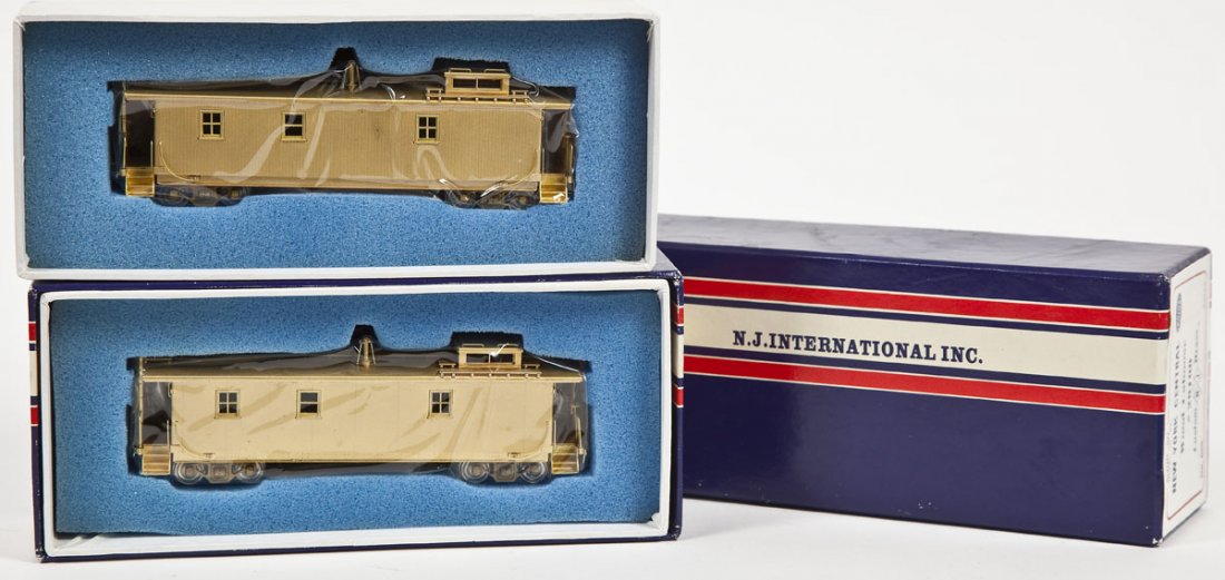 2 NJ Custom Brass NYC Cabooses #20100 & #20133: DESCRIPTION: Two NJ Custom brass New York Central cabooses including #20100 Wood and #20133 Pacemaker. HO scale. CONDITION: Appear slightly, if at all, used in original boxes.