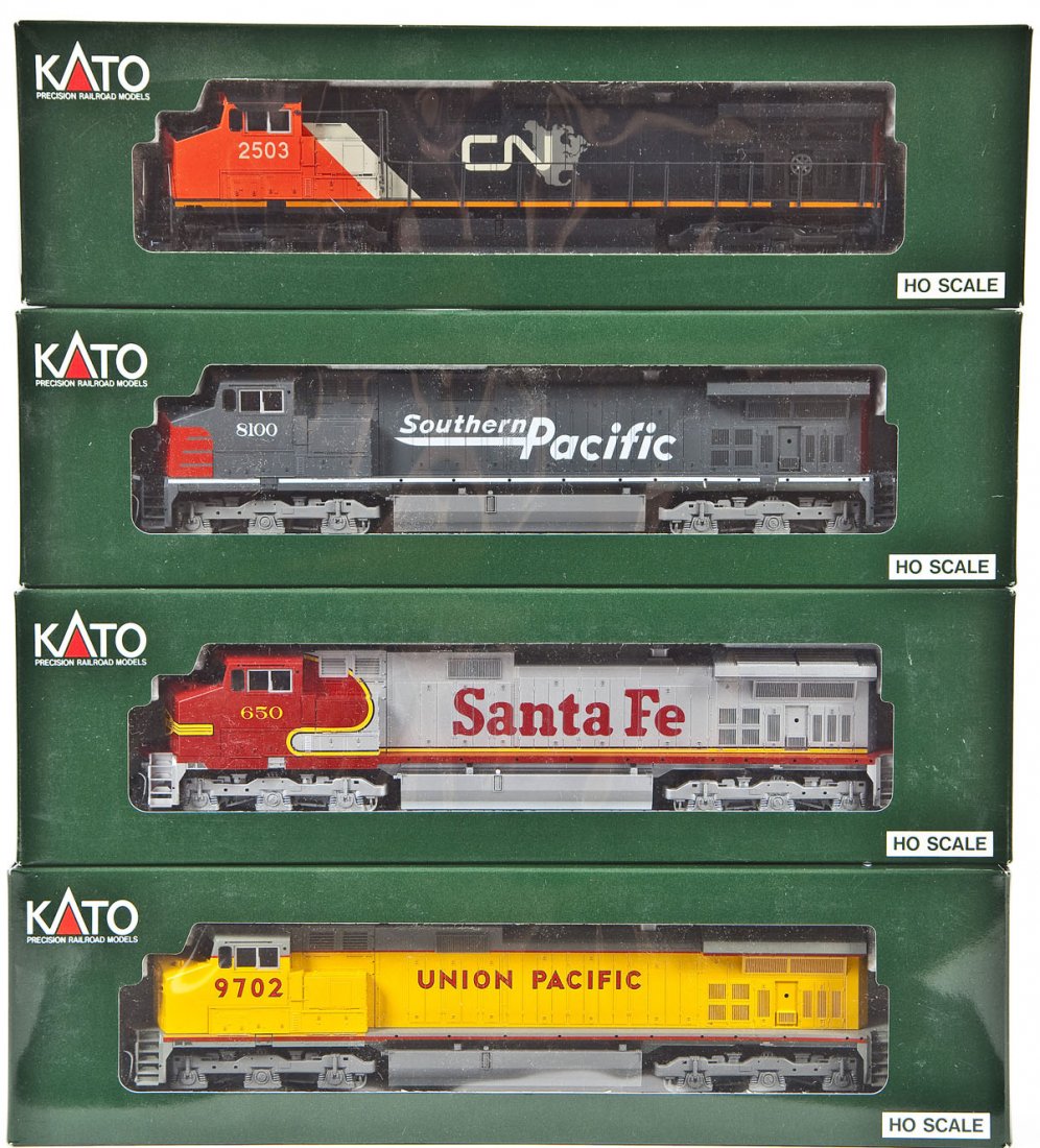 4 Kato C44-9W Locomotives: DESCRIPTION: Four Kato C44-9W locomotives including SP #8100, CN #2503, SF #650, UP #9702. HO scale. CONDITION: Appear unused in original boxes.