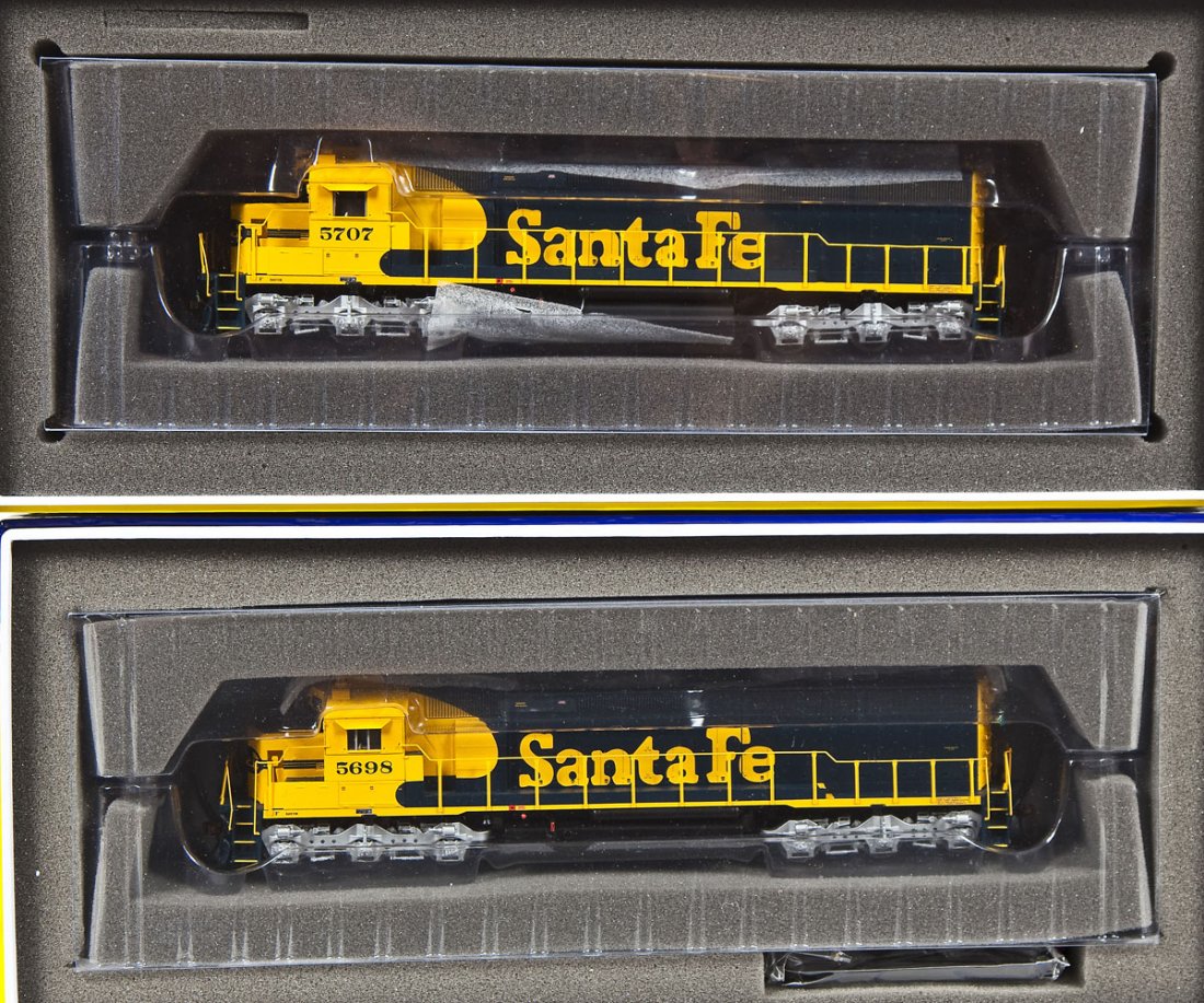 2 Genesis Santa Fe HO Locomotives: DESCRIPTION: Two Athearn Genesis Santa Fe locomotives including #5707 and #5698. HO scale. CONDITION: Appear unused in original boxes with paperwork.