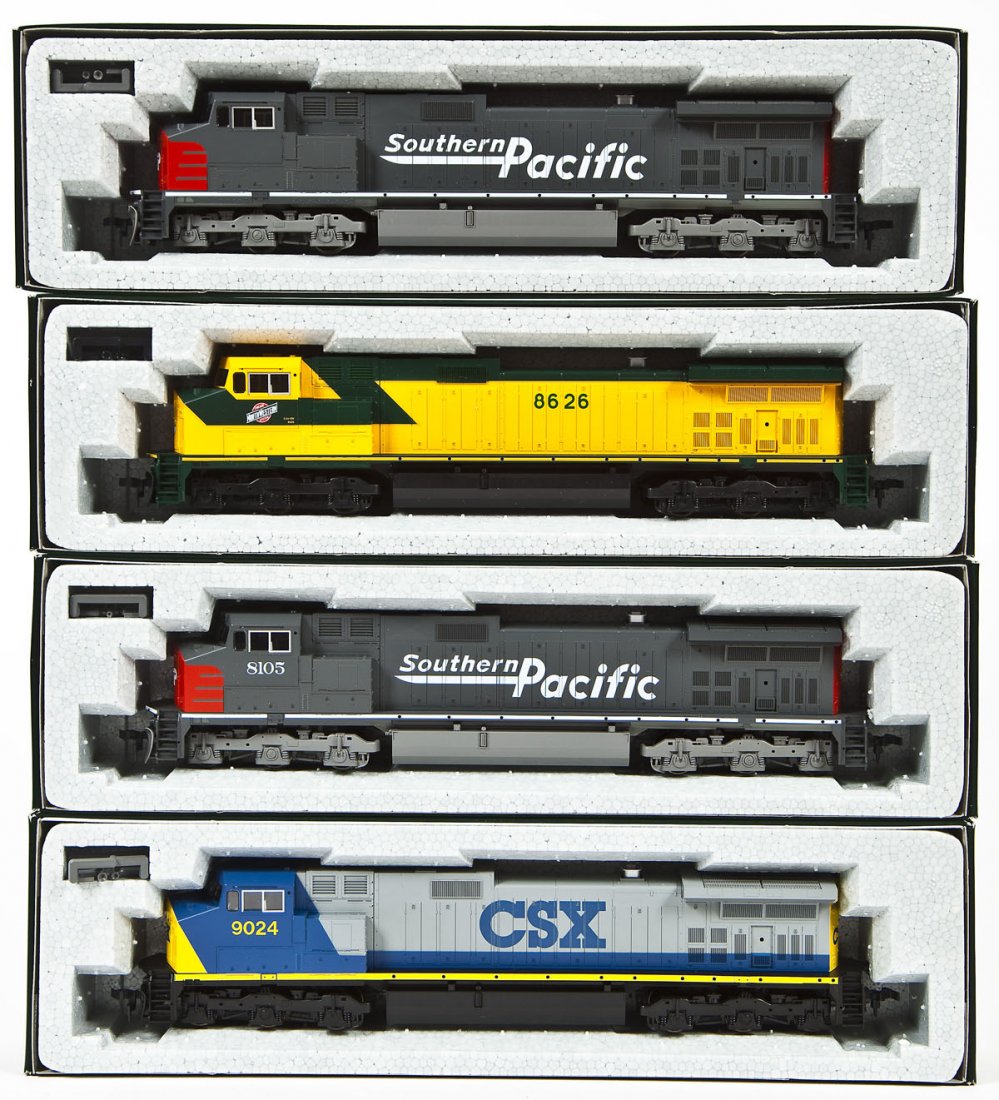 4 Kato C44-9W Locomotives: DESCRIPTION: Four Kato C44-9W locomotives including SP #8105, SP unnumbered, CSX #9024, and CNN #8626. HO scale. CONDITION: Appear unused in original boxes.