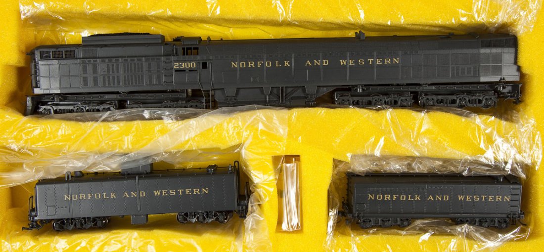 Alco KMT Jawn Henry Brass Locomotive & Tenders: DESCRIPTION: Alco Models KMT "Jawn Henry" painted brass locomotive and tenders. HO scale. CONDITION: Appears lightly, if at all, used in original box with paperwork.