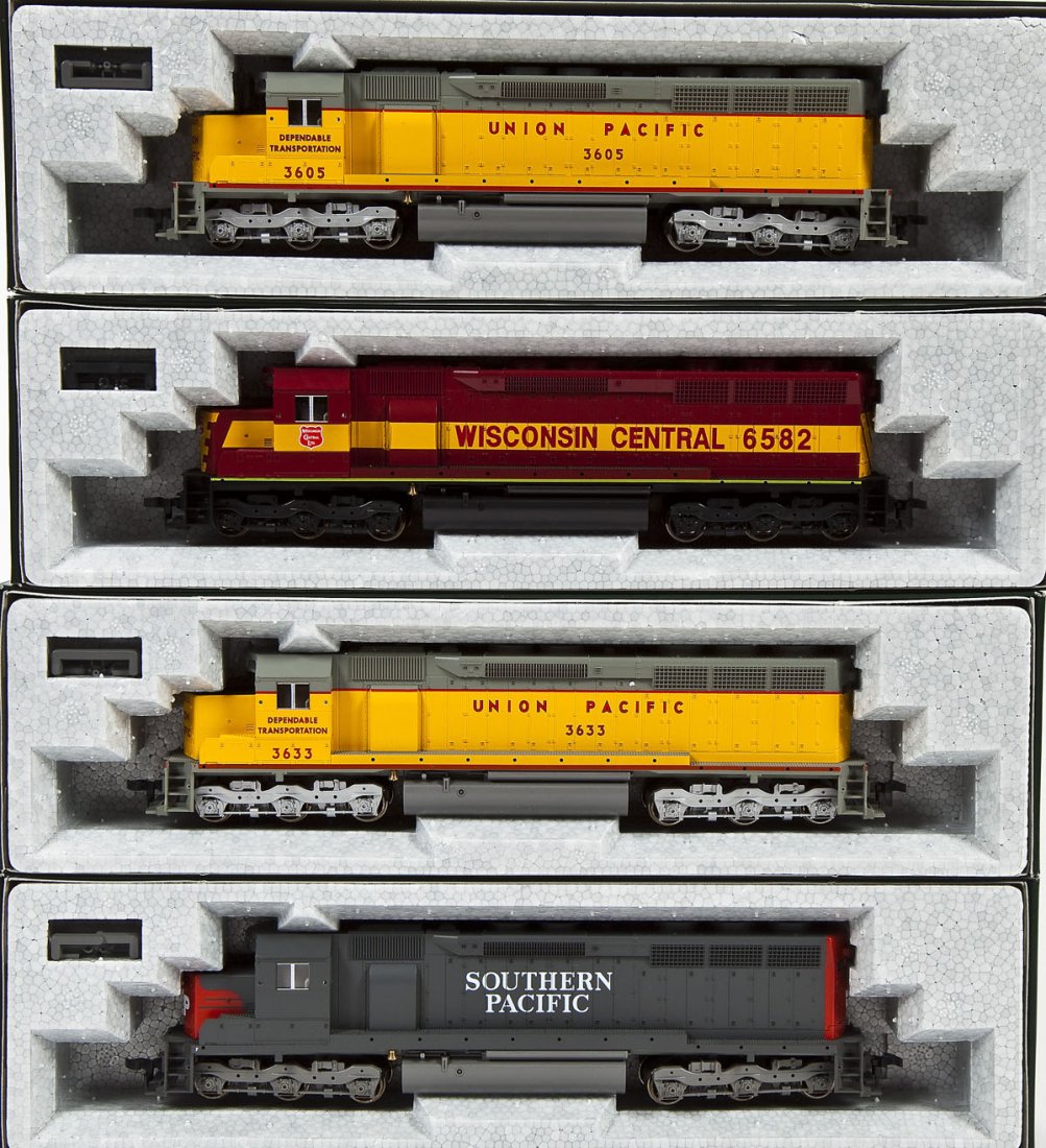 4 Kato SD45 Locomotives: DESCRIPTION: Four Kato SD45 locomotives including: WC #6582, SP (unnumbered), UP #3605, and UP #3633. HO scale. CONDITION: Appear unused in original boxes.