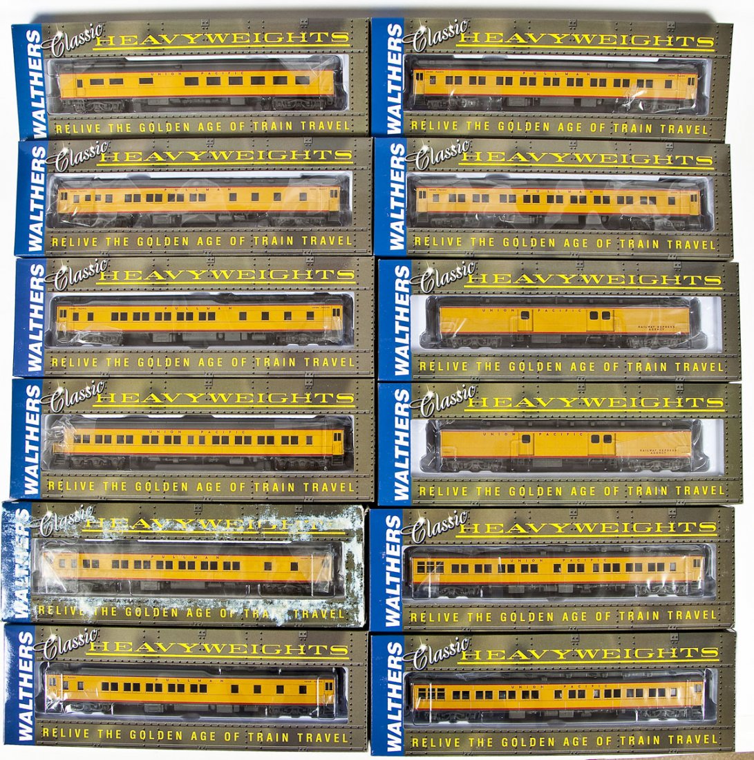 12 Walthers UP (Yellow) Pullman Heavyweight Cars: DESCRIPTION: Twelve Walthers UP (yellow) Pullman heavyweight cars. HO scale. CONDITION: Appear unused in original boxes. Some boxes with wear.