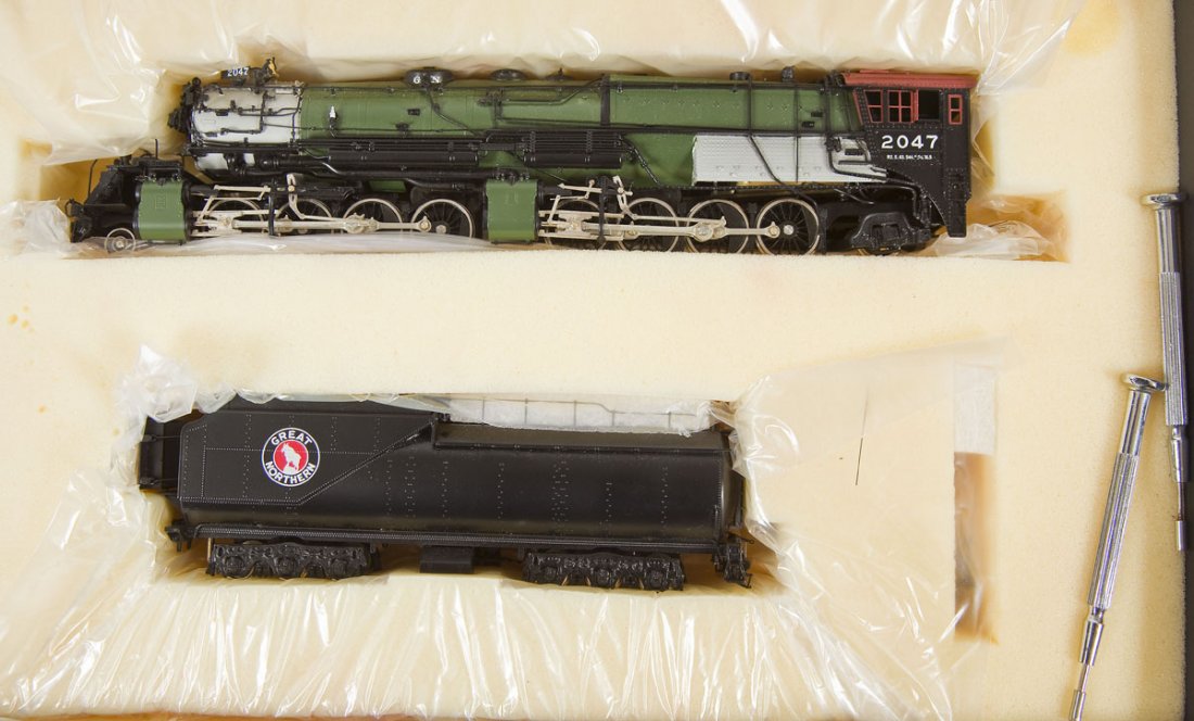 Key/Samhongsa Glacier Park Brass Loco & Tender: DESCRIPTION: Key Imports All-Weather Cab Custom Serial No. 82 Glacier Park painted brass locomotive and tender. Made by Samhongsa. HO scale. CONDITION: Appears slightly if at all used in original box 