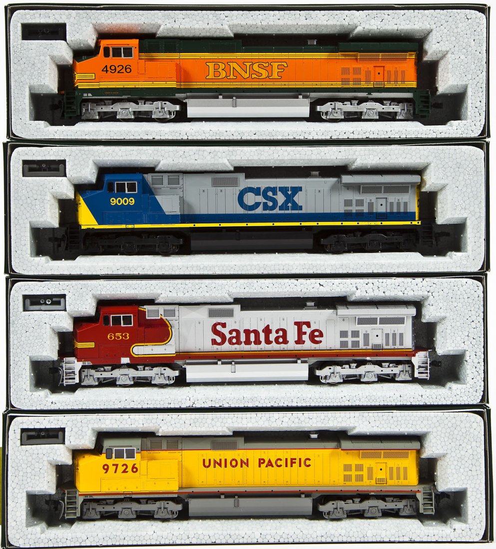 4 Kato C44-9W Locomotives: DESCRIPTION: Four Kato C44-9W locomotives including UP #9726, CSX #9009, BN-SF #4926, and SF #653. HO scale. CONDITION: Appear unused in original boxes.