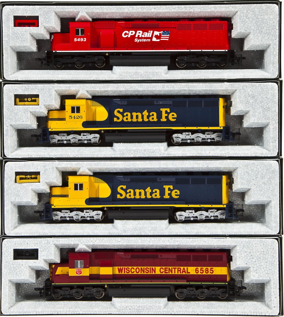 4 Kato SD45 Locomotives: DESCRIPTION: Four Kato SD45 locomotives including WC #6585, SF #5426, SF Unnumbered, and CP Rail #5493. HO scale. CONDITION: Appear unused in original boxes.