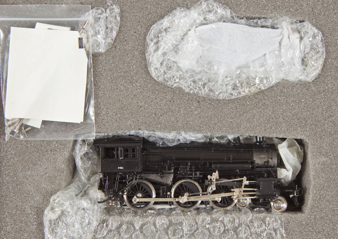 Precision Scale NYC 7-12E Brass Loco & Tender: DESCRIPTION: Precision Scale Company New York Central 7-12E painted brass locomotive and tender. HO scale. CONDITION: Appears slightly if at all used in original box.