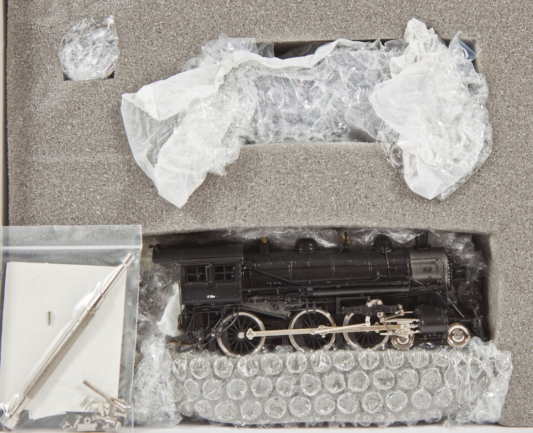 Precision Scale NYC F-12A Brass Loco & Tender: DESCRIPTION: Precision Scale Company New York Central F-12A factory painted brass locomotive and tender. HO scale. CONDITION: Appears slightly if at all used in original box with paperwork.
