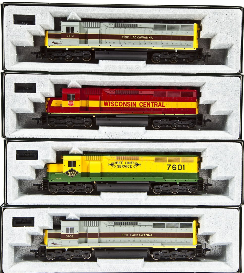 4 Kato SD45 Locomotives: DESCRIPTION: Four Kato SD45 locomotives including WC unnumbered, EL #3632, Reading #7601, and EL #3613. HO scale. CONDITION: Appear unused in original boxes.