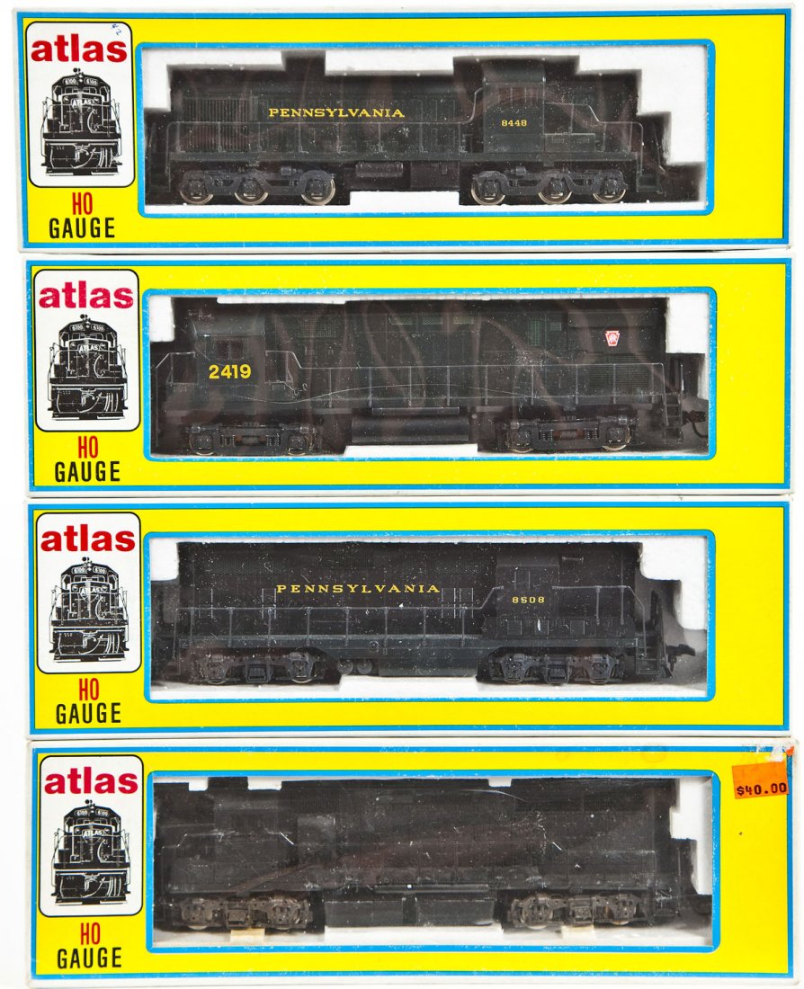 4 Atlas HO Locomotives: DESCRIPTION: Four Atlas locomotives including Pennsylvania unnumbered, Pennsylvania #8508, Pennsylvania unnumbered, and GP 40 undecorated. HO scale. CONDITION: Appear slightly if at all used in origin