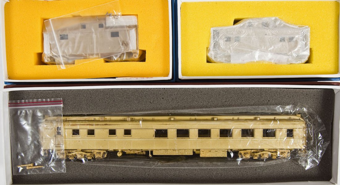 3 PRR Brass Cars incl Diner & Cabooses: DESCRIPTION: Three PRR brass cars including D78C Diner, N-5B caboose, and N-5E caboose. HO scale. CONDITION: Appear unused in original boxes.