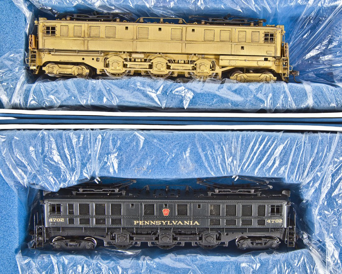 2 Alco Models PRR Rok-AM Brass Locomotives: DESCRIPTION: Two Alco Models PRR Rok-AM brass locomotives. Includes: 1) P-5A unpainted. 2) P-5B custom painted. HO scale. CONDITION: Appear slightly used in original boxes.