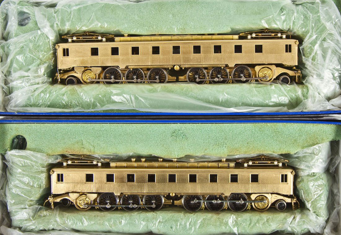 2 NJ Custom Brass PRR FF-1 Brass Locomotives: DESCRIPTION: Two NJ Custom Brass PRR Class FF-1 Electric brass locomotives. HO scale. CONDITION: Appear slightly if at all used in original boxes. Foam inserts disintegrating.