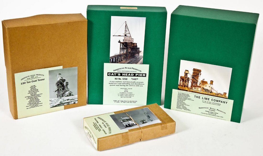 4 Sheepscot Scale Building Kits incl #1070, #1250: DESCRIPTION: Four Sheepscot Scale Products building kits including The Lime Company #1070, Cats Head Pier #1250, 150-Ton Coal Tower #1040 and Signal Tower #1030. CONDITION: Unused in original boxes.