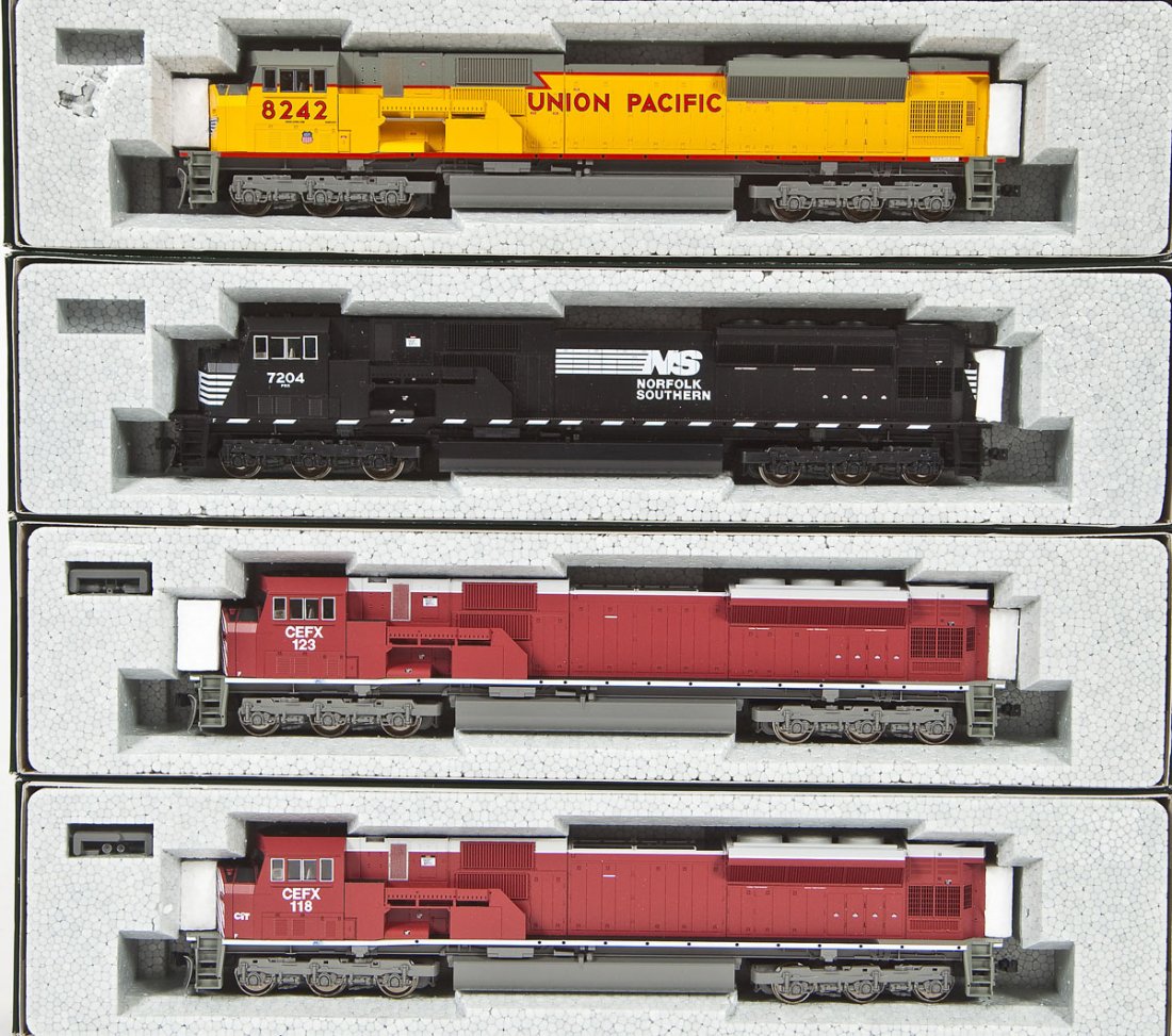 4 Kato HO Locomotives: DESCRIPTION: Four Kato locomotives incl CEFX #118, NS #7204, UP #8242, and CEFX #123. HO scale. CONDITION: Appear unused in original boxes.