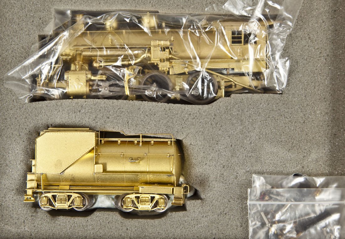 Key/Samhongsa M-21 Mogul Brass Locomotive & Tender: DESCRIPTION: Key Imports M-21 Class Mogul brass locomotive and tender. Made by Samhongsa. HO scale. CONDITION: Appear slightly if at all used in original box.