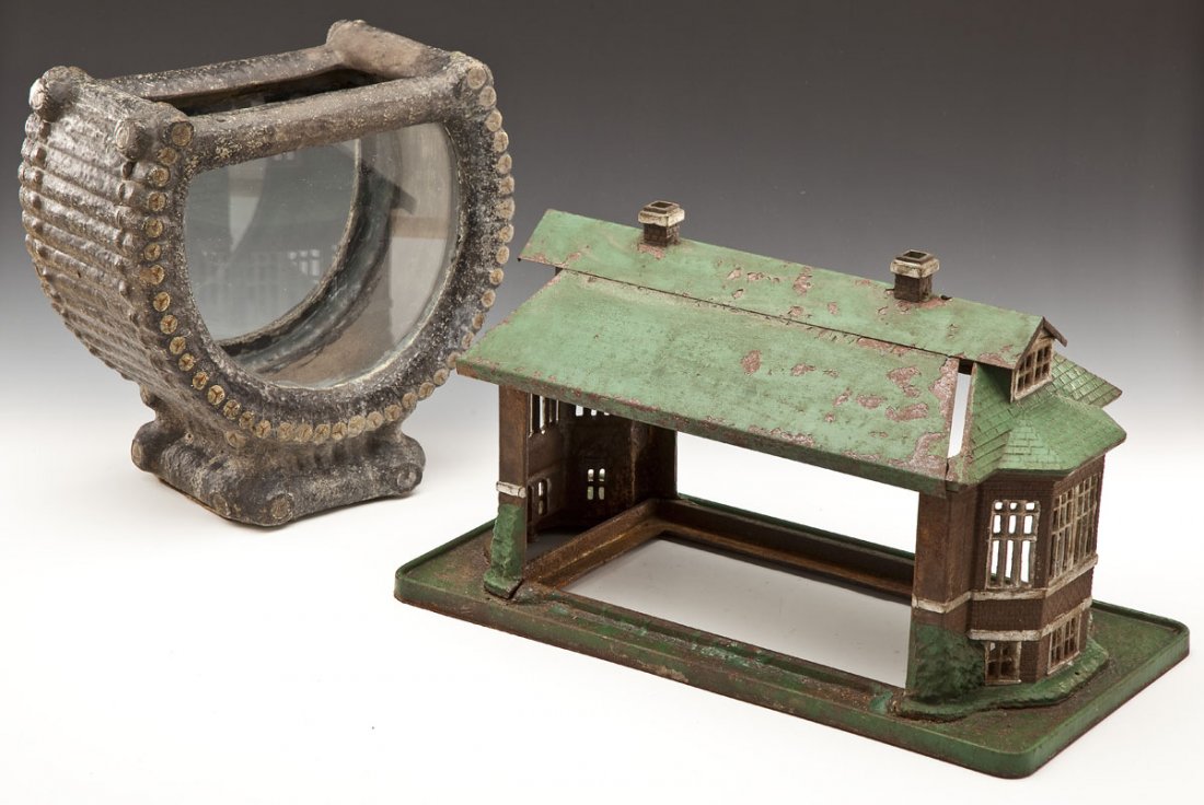 2 Antique Figural Fish Bowls: DESCRIPTION: Two antique fish bowls. Includes: 1) 13-1/2" x 13-1/2" painted plaster in the form of a log basket on log form base. Glass intact. 2) 20-1/2" x 12" house form of painted cast iron and tin