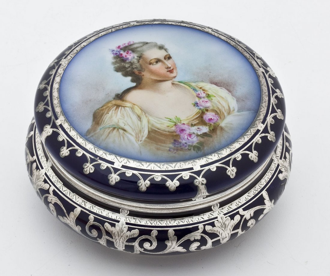 Porcelain Portrait Dresser Box with Silver Inlay: DESCRIPTION: Porcelain portrait dresser box with silver inlay. Blue ground with scrolled silver inlay in lid and bottom. Portrait of a woman with flowers in her hair and the neckline of her dress. Unm