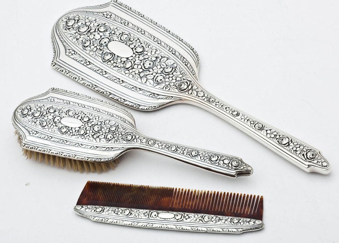 Wallace Normandie 3 Pc Sterling Dresser Set: DESCRIPTION: Wallace sterling three piece dresser set. Normandie pattern. Brush, mirror, and tortoise shell comb. Each marked "Sterling 94". Brush and mirror with Wallace maker's mark. MEASUREMENTS: B
