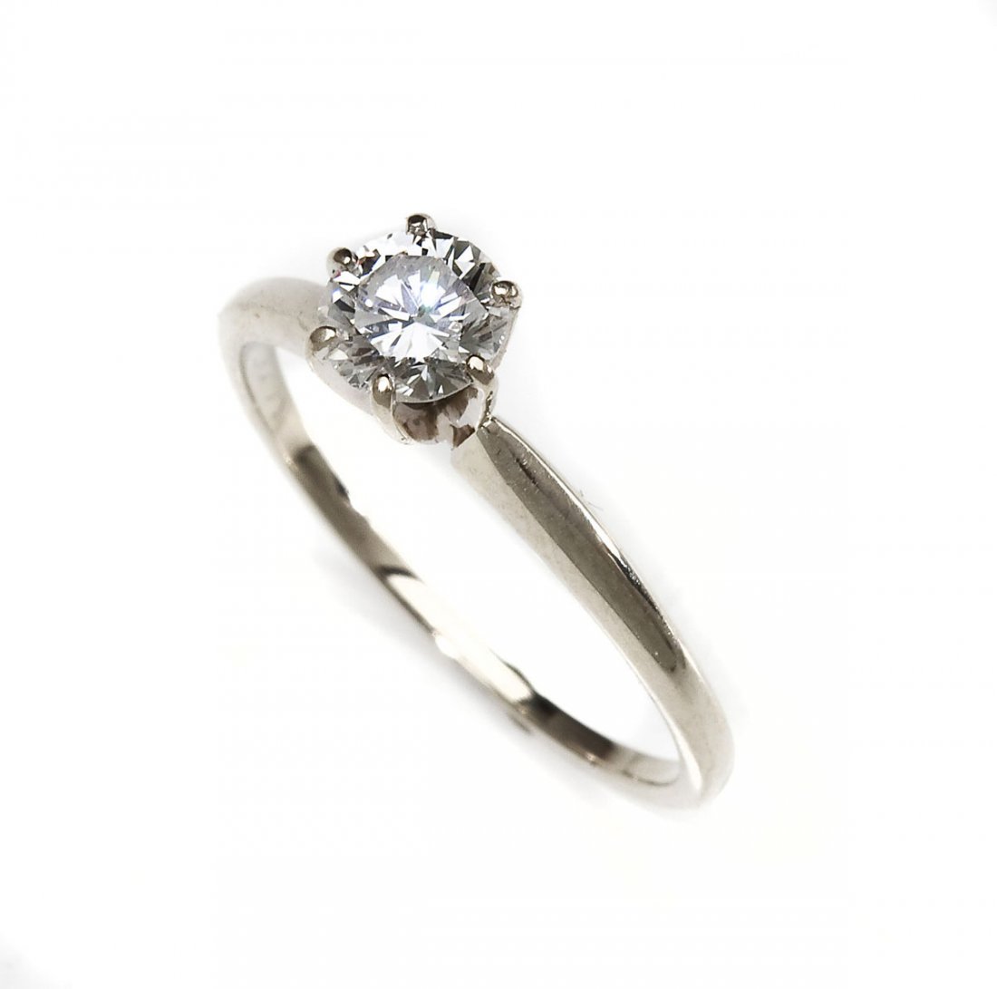 .53 Carat Diamond Solitaire: DESCRIPTION: Diamond solitaire in marked 14K white gold. Set with one .53 carat round brilliant cut diamond. Clarity I1, color G. MEASUREMENTS: Size 7. 1.2 dwt (1.8 gr). CONDITION: No defects noted. A