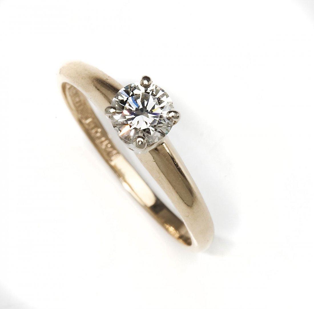 .55 Carat Diamond Solitaire: DESCRIPTION: Diamond solitaire in marked 14K two tone gold. Set with one .55 carat round brilliant diamond . Clarity SI2, color I. MEASUREMENTS: Size 7. 1.6 dwt (2.5 gr). CONDITION: Prongs rebuilt. Se