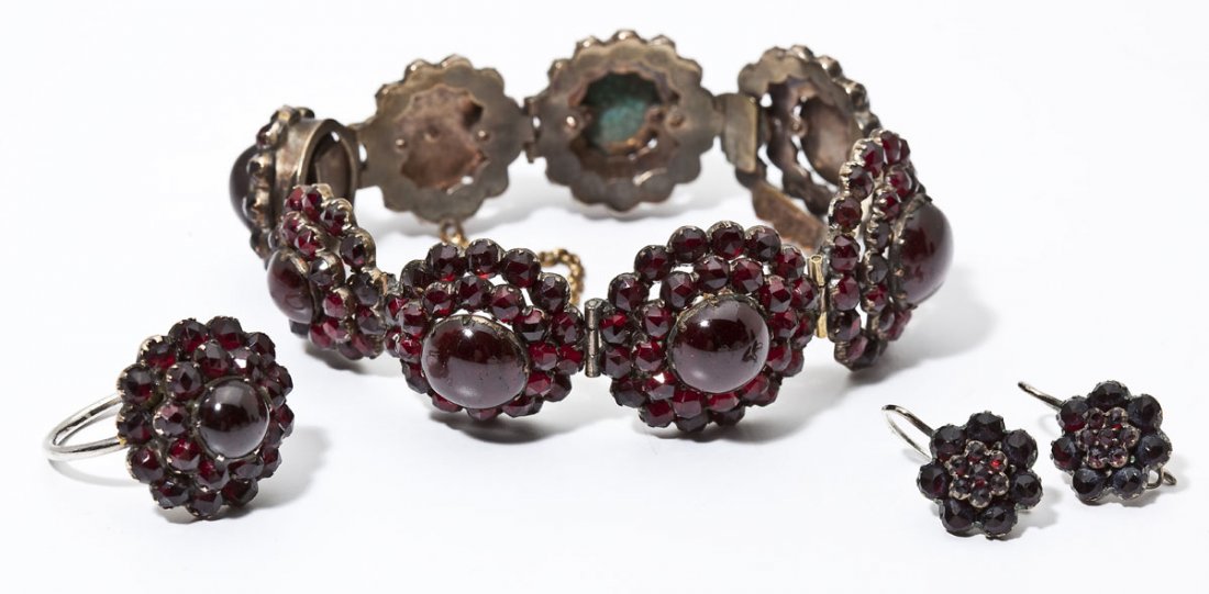 Antique Bohemian Carbuncle Garnet Demi-Parure: DESCRIPTION: Antique Bohemian carbuncle garnet assembled demi-parure comprising a 6-5/8" bracelet, size 7 ring and a pair of 3/4" hook earrings. MEASUREMENTS: See Description. CONDITION: Bracelet with