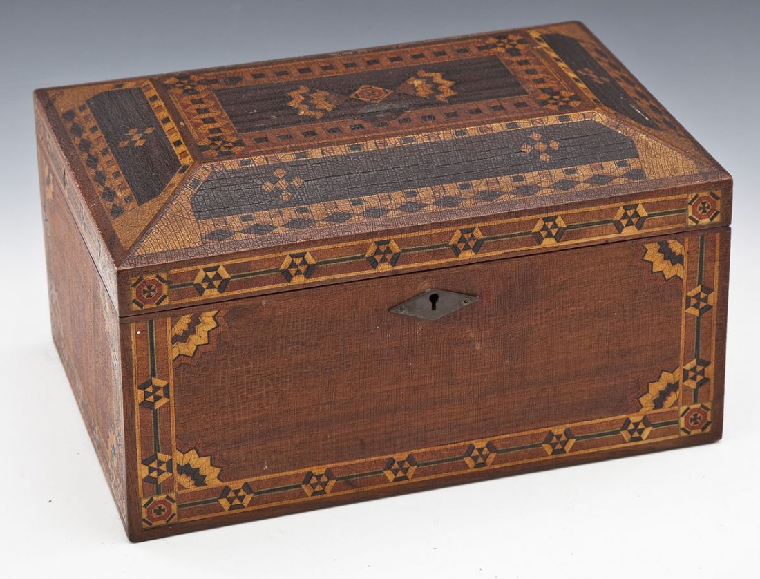 19th C Parquetry Inlaid Jewelry Box: DESCRIPTION: Casket form box with geometric parquetry inlay of various woods. Interior and single removable tray lined in red velvet, the inside lid with beveled oval mirror. 19th century. MEASUREMENT