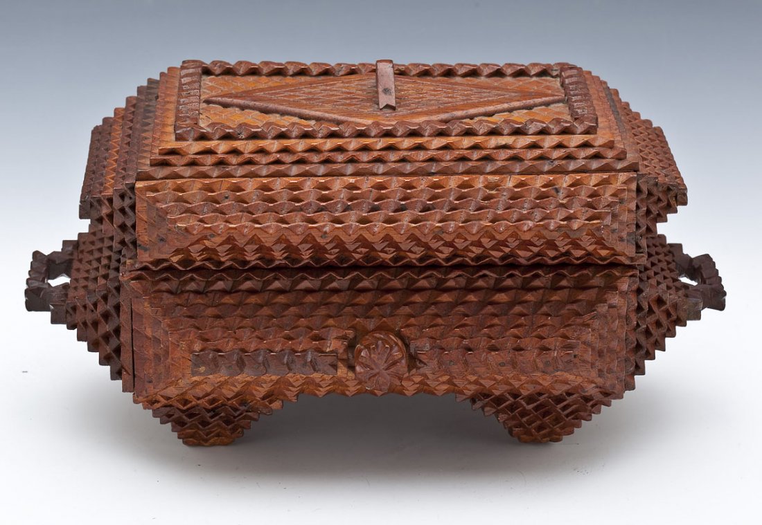 Pennsylvania Tramp Art Box C 1900: DECRIPTION: Chip carved tramp art box of casket form with chip carved handles and chip carved knob that turns to lock and unlock the box. Green felt interior with framed inscription in lid "To Sister 