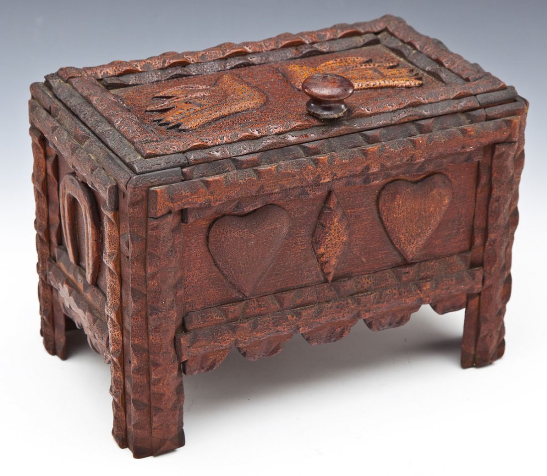 Pennsylvania Tramp Art Sewing Box with Contents: DESCRIPTION: Tramp Art sewing box with lift top lid with doves. Side panels with horseshoes, the front with hearts and diamond and the back with hearts and cross. Chipped carved edges and legs. Cigar 