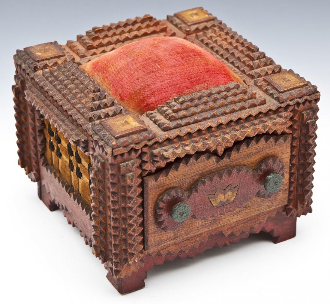 Painted & Inlaid Tramp Art Box with Pin Cushion: DESCRIPTION: Chipped carved tramp art box with red velvet covered pin cushion and inlaid corners to top. Unusual fabric inset side panels with red painted frames. Single front fabric lined drawer with