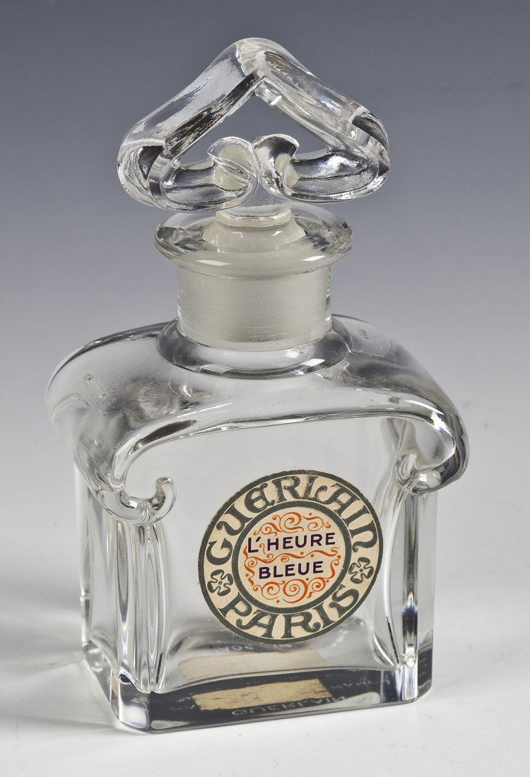 Guerlain L'Heure Bleue Perfume Bottle & Box: DESCRIPTION: Vintage Guerlain L'Heure Bleue French crystal fatice perfume bottle and Guerlain box. Label on front of bottle "Guerlain Paris L'Heure Bleue". Guerlain label on the bottom of the bottle w