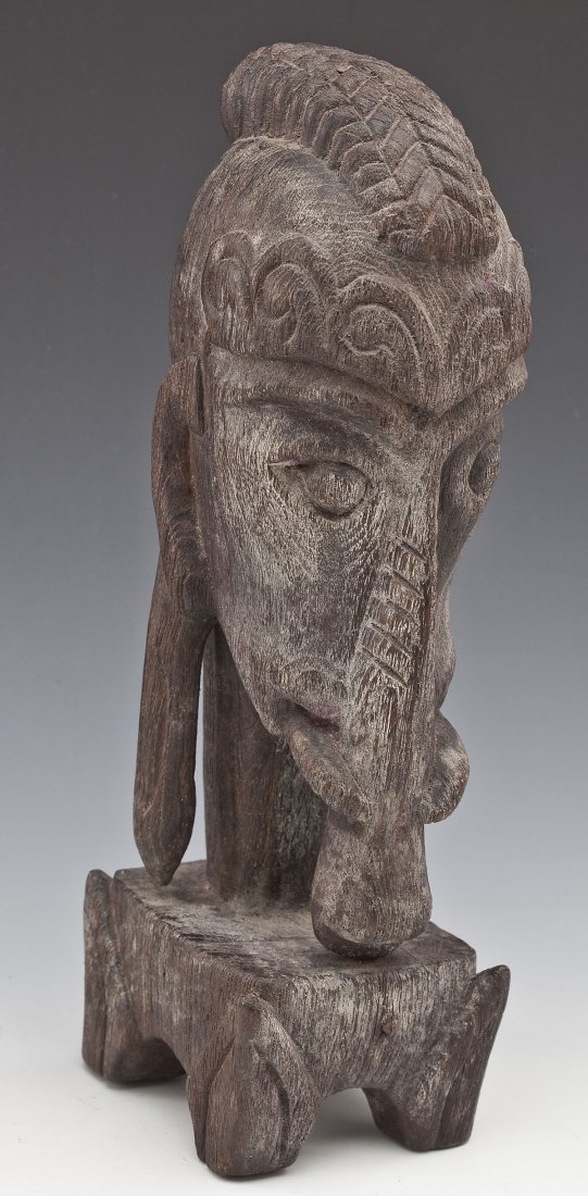 Nias Tribe Protection Fetish Indonesia: DESCRIPTION: Nias Tribe carved wood protection fetish, East Archipelagos, Indonesia. 19th century. MEASUREMENTS: 11-1/2". CONDITION: Light wear as expected with age.