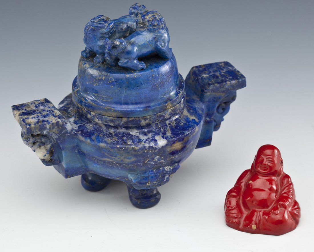 Chinese Lapis Incense Burner & Lacquer Buddha: DESCRIPTION: Chinese miniature lapis incense burner with carved handles and foo dog legs and finial. Together with a miniature red lacquer seated Buddha. MEASUREMENTS: Incense 3-1/2" x 4". Buddha 1-1/