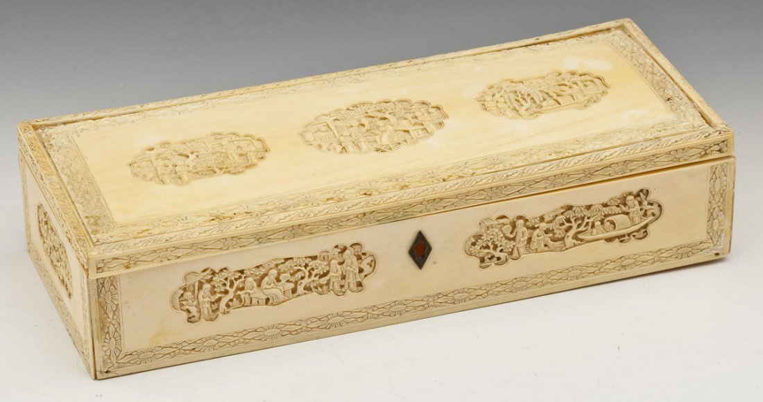 Chinese Carved Ivory Jewelry Box: DESCRIPTION: Chinese ivory jewelry box of rectangular form and carved with cartouches of figures with floral and foliate borders. Metal escutcheon. MEASUREMENTS: 10-1/4" x 4-1/8" x 2-1/4" high. CONDIT