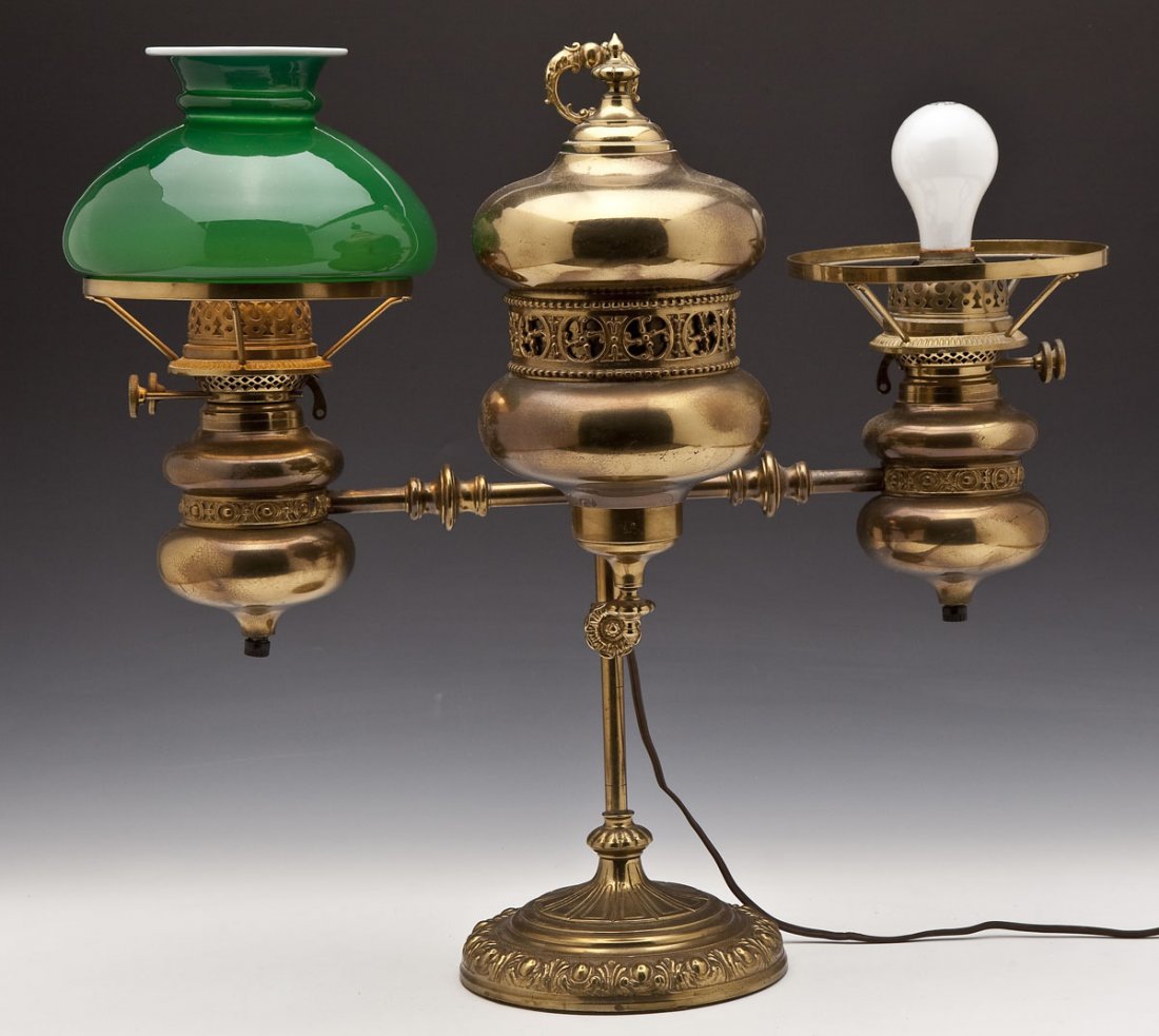 Brass Double Arm Student Lamp: DESCRIPTION: Adjustable brass double arm student lamp attributed to Thomas Adams and retailed by Bailey, Banks & Biddle. Urn form fonts with decorative bands. Burner knobs marked "Bailey, Banks & Bidd