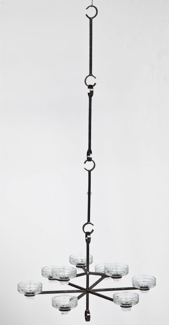 Erik Hoglund 9 Light Chandelier: DESCRIPTION: Mid-century Erik Hoglund (Swedish, 1932-1998) nine light chandelier. Cast iron body and linked hanging fixture with removable glass cups. Marked "Made in Sweden". Erik Hoglund was taken o