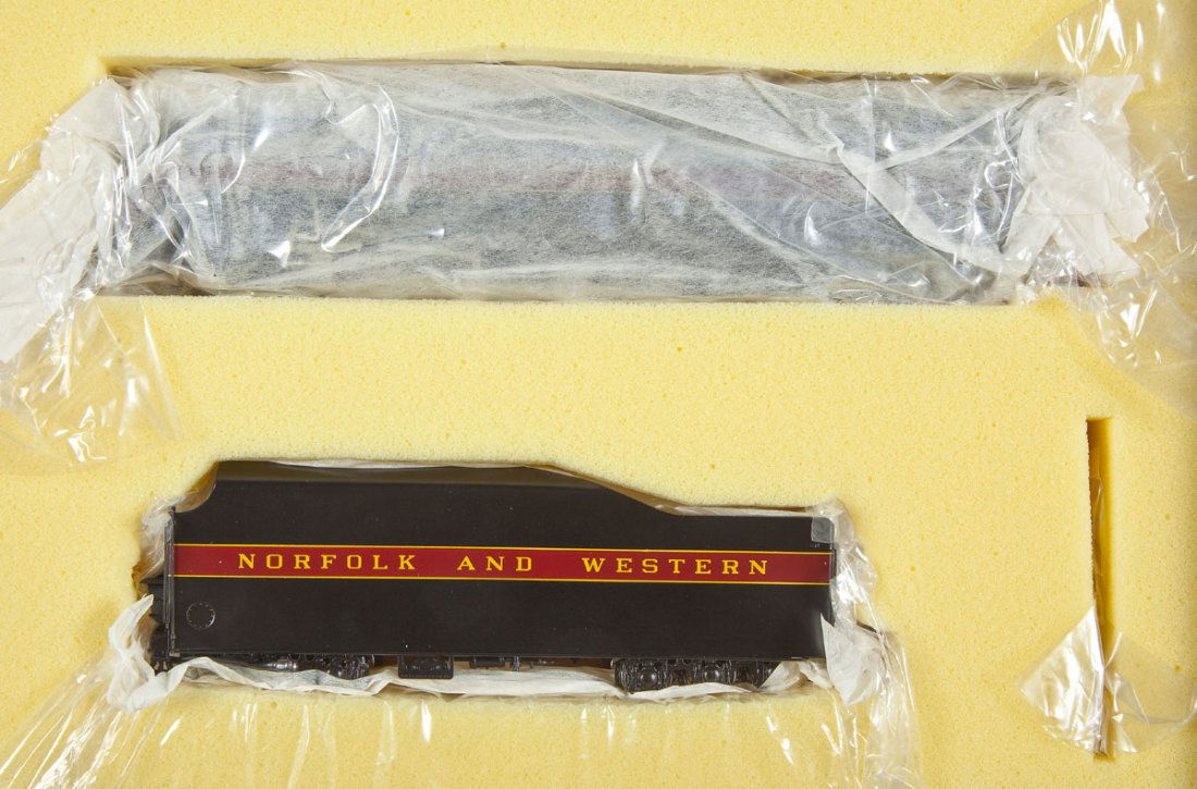 Key Imports/Samhongsa N&W #600 Brass Loco & Tender: DESCRIPTION: Key Imports N&W J #600 Class painted brass locomotive and tender made by Samhongsa. CONDITION: Appears unused in original box with paperwork.