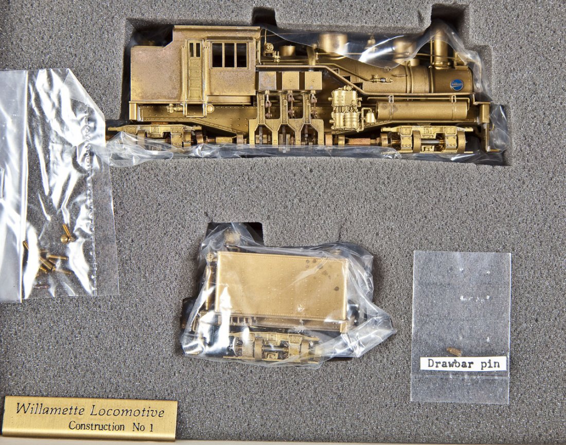 United Scale/Atlas Lumber Brass Loco & Tender: DESCRIPTION: United Scale Models Willamette Coos Bay Lumber Co. brass locomotive and tender made by Atlas. CONDITION: Appears slightly at if all used in original box with paperwork. Both pieces with p