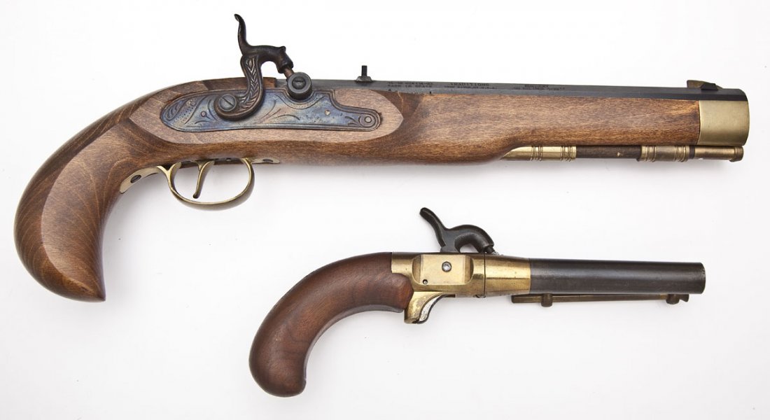 2 Black Powder Percussion Pistols: 1) Traditions Kentucky Percussion Pistol - .50 Cal. SERIAL #: 14-13024114-95 DESIGN: Single shot black powder pistol. 9-7/8" barrel. MATERIAL/FINISH COMPOSITION: Blued steel. Case hardened lock assemb