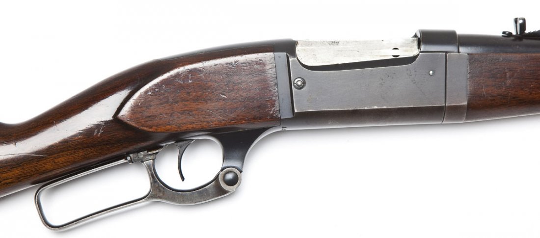 Savage Model 1899 Rifle - .250-3000 Cal.: SERIAL #: 250564 DESIGN: Lever action with internal magazine. 22" round barrel. MATERIAL/FINISH COMPOSITION: Blued steel. Case hardened lever. Wood straight stock and forearm. FEATURES: Raised blade f