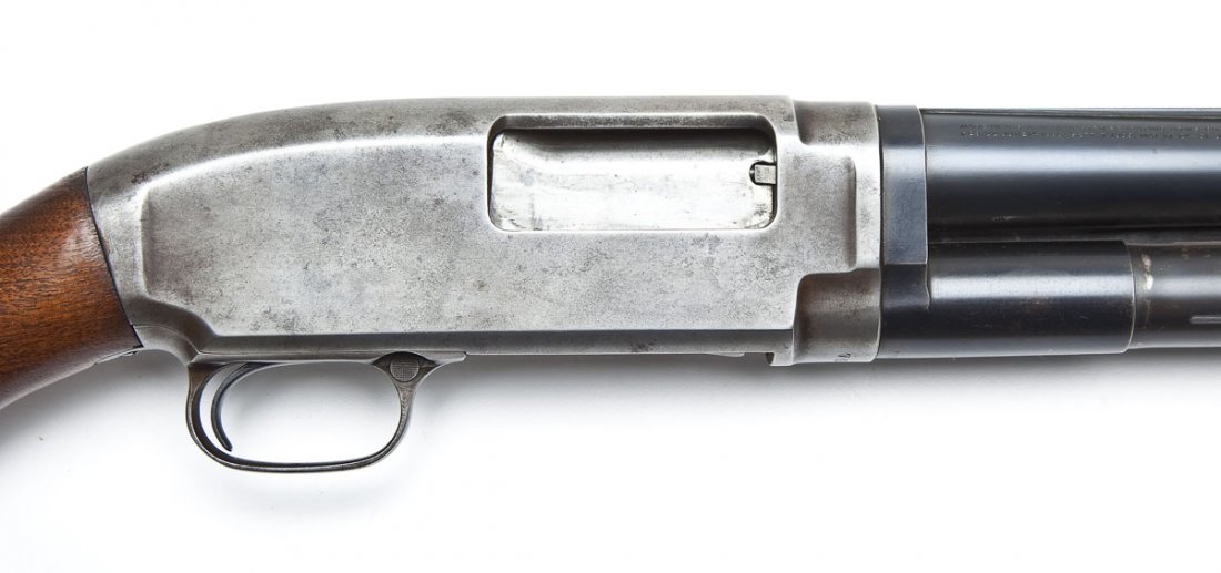 Winchester Model 12 Shotgun - 12 Ga.: SERIAL #: 791026 DESIGN: Pump action with tubular magazine. 30" modified choked barrel with solid rib. Chambered for 2-3/4" shells. MATERIAL/FINISH COMPOSITION: Blued steel. Wood pistol grip stock and