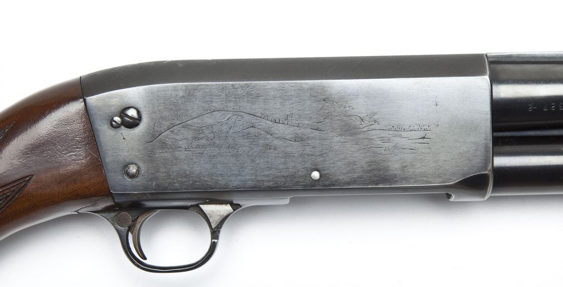 Ithaca Model 37R Featherlight Shotgun - 12 Ga.: SERIAL #: 679327 DESIGN: Pump action with tubular magazine. 28" modified choked barrel with solid rib. Chambered for 2-3/4" shells. MATERIAL/FINISH COMPOSITION: Blued steel. Checkered pistol grip stoc