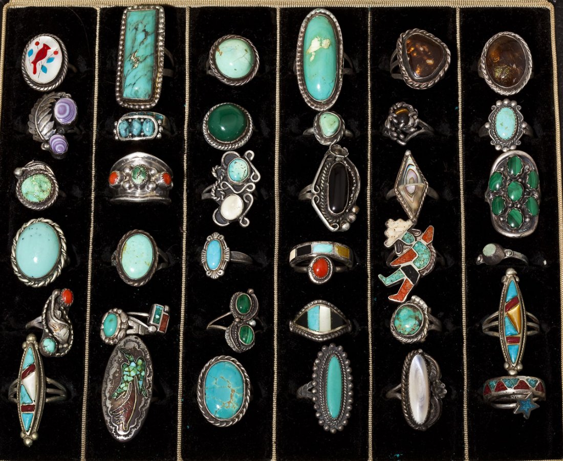 Collection of 40 Native American Hardstone Rings: DESCRIPTION: Collection of forty Native American and Native American style silver rings set with various hardstones including turquoise, coral, abalone and onyx. MEASUREMENTS: Various. CONDITION: Some
