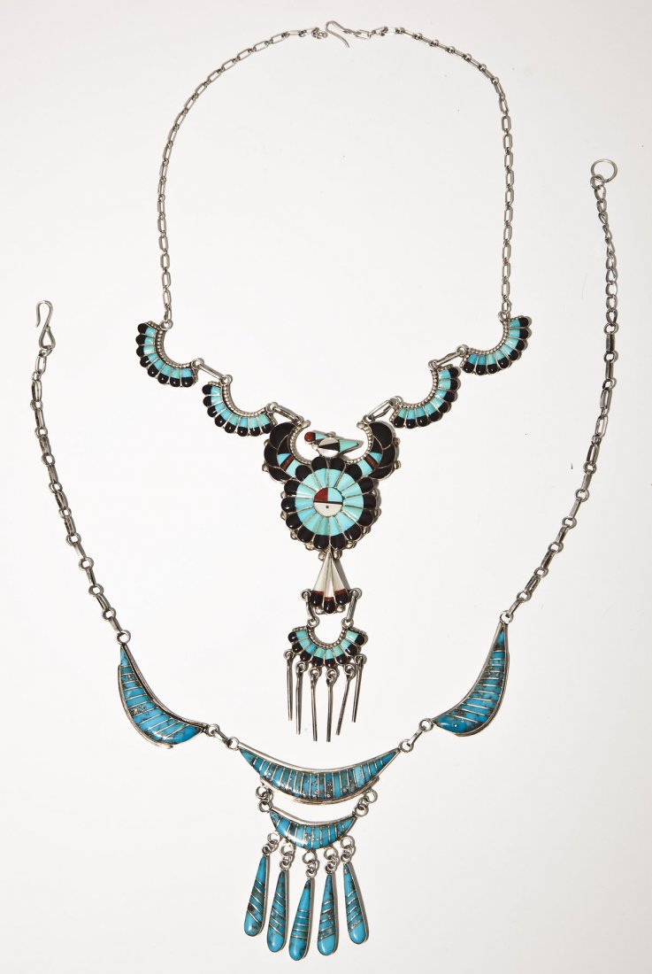 2 Zuni Silver & Stone Necklaces incl Thunderbird: DESCRIPTION: Two Zuni silver and stone necklaces. Includes: 1) Thunderbird necklace set with turquoise, onyx, carnelian and mother of pearl. Pendant 4-1/2" x 2". Chain 17-3/4" end to end. 2) Necklace 