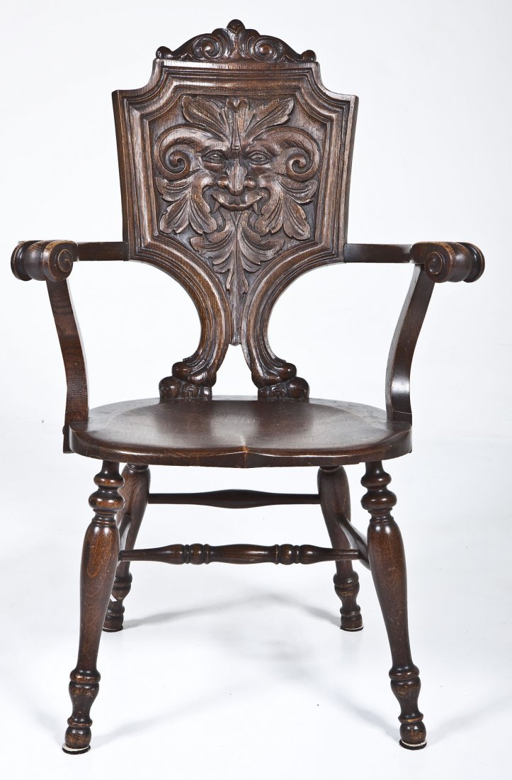 Celtic Green-Man Arm Chair: DESCRIPTION: Carved Jacobean Revival arm chair featuring a splat carved in the image of the Celtic Green-man. Probably Midwestern in origin, circa 1910-30. The finely turned legs and stretchers joinin