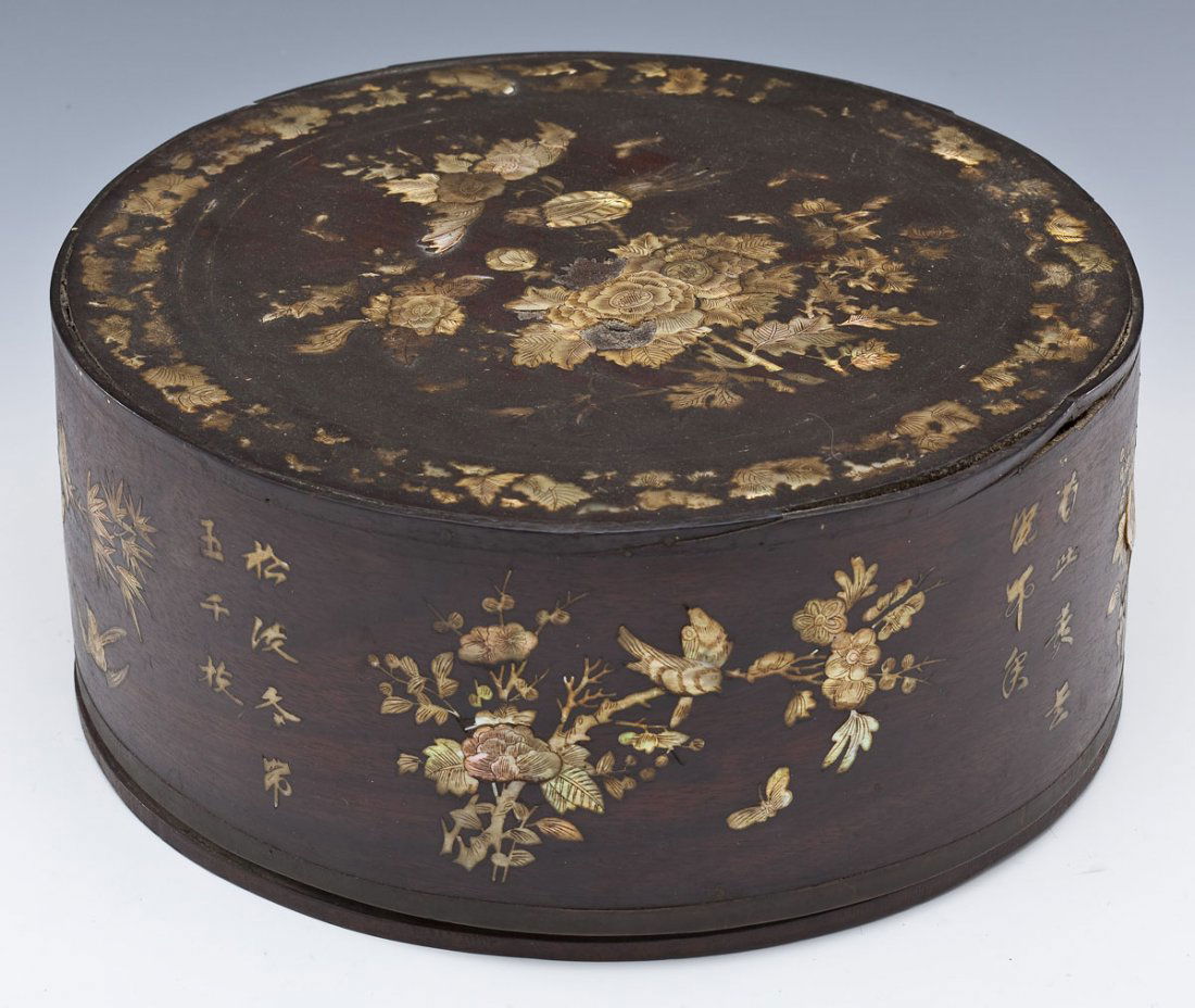 Chinese Box with MOP Inlay: DESCRIPTION: Chinese box with mother of pearl inlay. Inlay on lid of box as well as sides of box. Depicts flowers, birds, leaves, and Chinese characters. MEASUREMENTS: 10-1/4" diameter x 4-1/2" high.