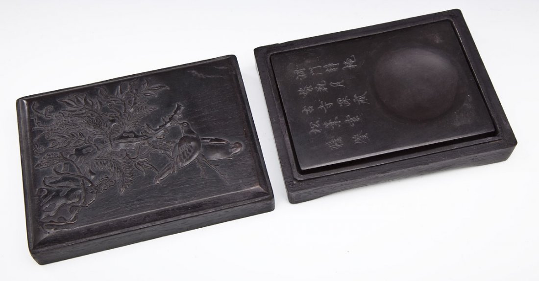 Chinese Duan Inkstone with Carved Wood Box: DESCRIPTION: Chinese duan inkstone carved with poem. Housed in fitted box carved to lid with birds on flowering branches. MEASUREMENTS: 4" x 5-1/2". Box 5" x 6-1/2". CONDITION: Stone with small chip u